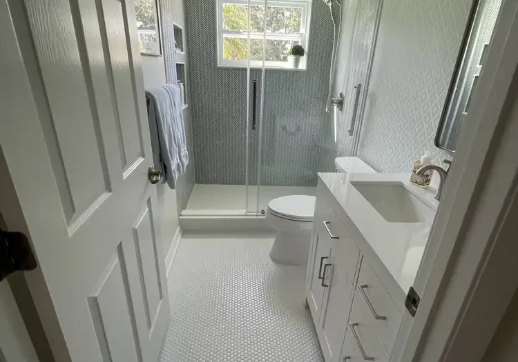 Remodeled bathroom with walk-in shower and vanity